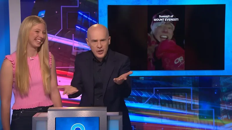 Bianca on the TV show Have You Been Paying Attention?, with her summit video on screen
